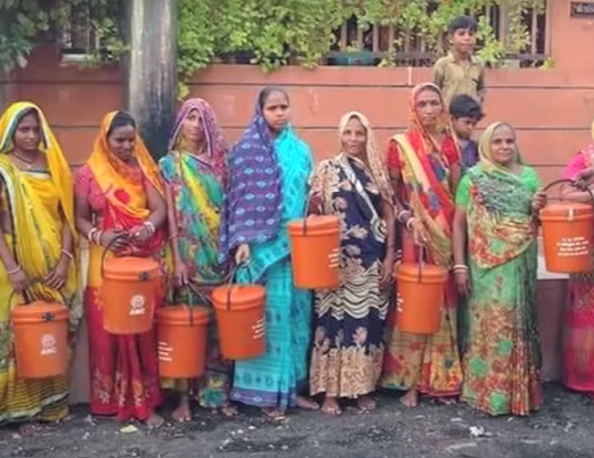 Orange dust bin distributed by corporator in Ahmedabad